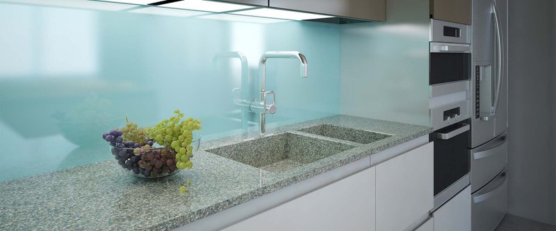 Modern kitchen clean interior design. Marble working area with a light blue wall and built-in lighting. Cabinets white and brown colors, built-in appliances. 3D render