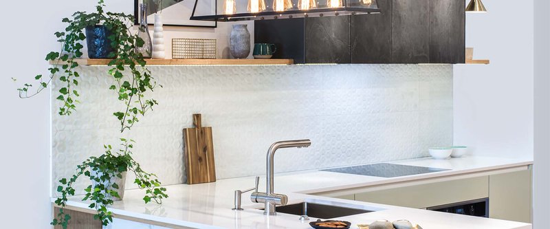 Modern kitchen design in home interior. Facades are painted and made of natural stone. Project management. Loft Light Fixture Lights in Black Metal Frame Shade with Clear Panel Glass. Copper Wire.